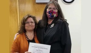 Photos by L. ParsonsThe Winslow Unified School District Governing Board and Superintendent Connie Gover (right) recognized Ruby Carson (left) as one of the employees of the month for January.
