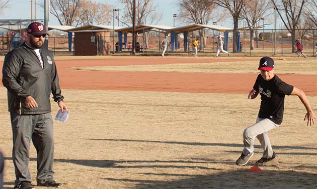 Photo by L. ParsonsWinslow High School spring sports began last week which includes Bulldog baseball. Here, senior Tristan Carrell (right) runs drills during a try out session for Coach Brandon Guzman (left). The season is slated to begin versus Safford on Feb. 25.