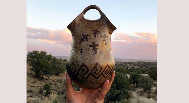 Photo courtesy of Northland Pioneer CollegeAdrian Herder’s "Dragonwater" piece is one example of the beautiful works he creates using the pit firing process.