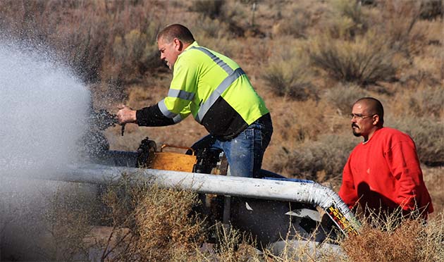 Photo courtesy of the City of HolbrookWorkers with the City of Holbrook repaired an 18-inch water main on the south side of the Little Colorado River that serves the people of Holbrook. Water/Wastewater Supervisor Randy Sullivan (left) and Daniel Gabaldon (right) were part of the crew working on the break. According to Sullivan, the rubber seals on a coupling wore out and could no longer be tightened to stop the leak. The system had to be shut down on Feb. 14 for a short time from the wells to the river and then shut off the lower section of the town off in order for the pressures to be low enough for the repair to be made.