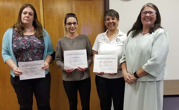 Photo by L. ParsonsThe Winslow Unified School District Governing Board recognized the employees of the month of March. Pictured are (left to right) Tamara Dooley, substitute teacher; Mica Vasquez, Bonnie Brennan secretary; Deb Lopez, Winslow Junior High School Principal; and Superintendent Connie Gover. Not pictured was Leroy Thomas, WJHS math/science teacher.
