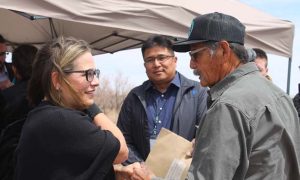 Photos by L. ParsonsSen. Krysten Sinema (left) congratulated former Navajo County Supervisor Jesse Thompson (right) on the funding of the Winslow Levee project as current Supervisor Alberto Peshlakai (center) listened in. Thompson was integral in starting the conversation with leaders in Washington, D.C. about the need for the reconstruction of the Winslow Levee.