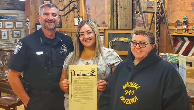 Photo courtesy of Winslow Police Department Winslow Police Chief Ken Arend (left), Caitlin Cunningham (center) and Belle Dalton were presented with the mayor’s proclamation of April 10-16 as Public Safety Telecommunications Week in Winslow.