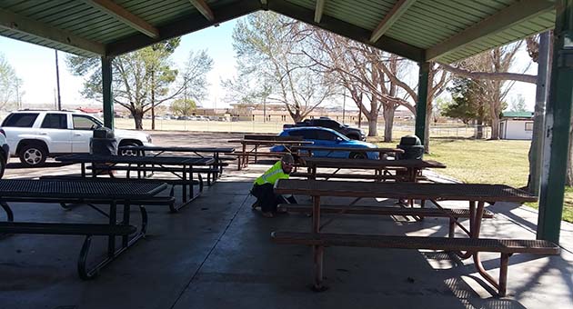 Photo courtesy of the City of HolbrookCity of Holbrook employee Shannon Kelley (pictured), assisted by Sean Cassidy installed new picnic tables at Hunt Park. The cost for the tables was $9,916, which was grant funded.