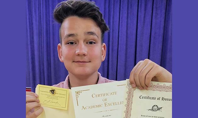 Photo by Tasha CouchmanWinslow High School freshman Benjamin Couchman shows off his Honor Roll award and Academic Letter at the Elks Lodge Awards Banquet last week. High school students who displayed outstanding athletic and academic prowess over this school year were recognized by the Elks Lodge and members of the Winslow Unified School District Governing Board.