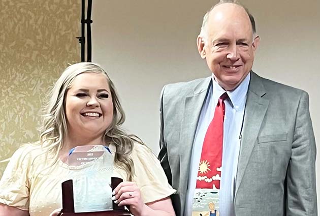 Angelica Estrada (left) was honored as the 2022 Victim Advocate of the Year by the Arizona Prosecuting Attorneys’ Advisory Council for her work with victims of physical and sexual violence. Pictured with Estrada is Navajo County Attorney Brad Carlyon.