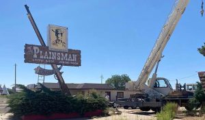 Photo by Robin GonzalesThe City of Holbrook lost a piece of history last week with the removal of The Plainsman restaurant sign on Hopi Drive. The sign was purchased by a collector in California who has plans to restore the sign. The Plainsman was opened in the mid-60s and has been shuttered for many years.