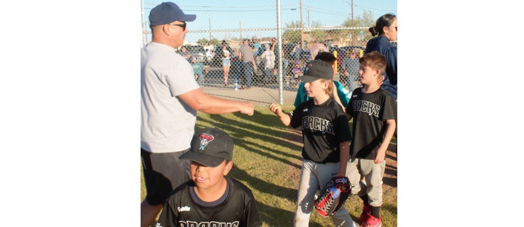 Photo by L. ParsonsThe regular season of the Winslow Little League wrapped up this week. Here, opposing players and coaches shake hands following a hard played minor league game. Coach Robin Villanueva congratulates players Stephen Waconda (left), Blaine Williams (center) and Jaxsyn Lopez (right).