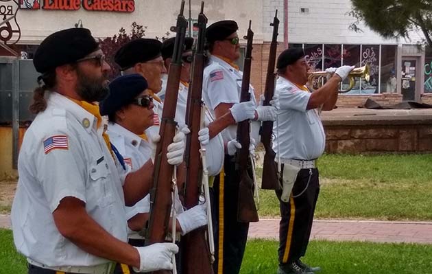 Photos by Beverly GoodnightMembers of Holbrook’s American Legion Post No. 37 Honor Guard presented arms while bugler Vidal Serna played taps during the Flag Day service held at the historic Navajo County Courthouse on June 12. The various American flags used throughout history were also displayed by the Order of the Elks during the Flag Day service.