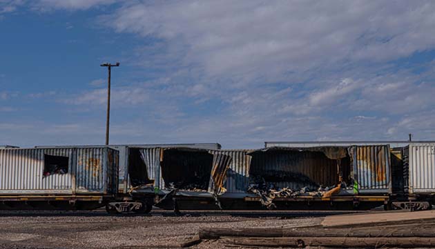Photo by Richard LarsonOn Saturday, July 9, the Winslow Fire Department was called to extinguish a fire in two shipping containers on a train on the BNSF railroad west of Winslow. It was reported the one container contained furniture and spread to the second container which held pool supplies and chemicals. Water was still dripping from the shipping containers this morning. The four cars involved were moved to a siding next to the Gazebo downtown. The cause of the fire remains under investigation.