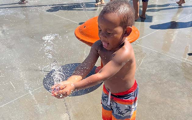 Photos by Sheila Mitchell and Evan Bengson Winslow celebrated the opening of its splash pad last week. The free feature is open from 9 a.m. to 7 p.m. daily and is located on Maple Street where it is sure to be a hit with kids of all ages including 2-year-old Kahmil Greer (left) and Grant Bengson (right) who were among the first groups of visitors to the latest amenity in the community.