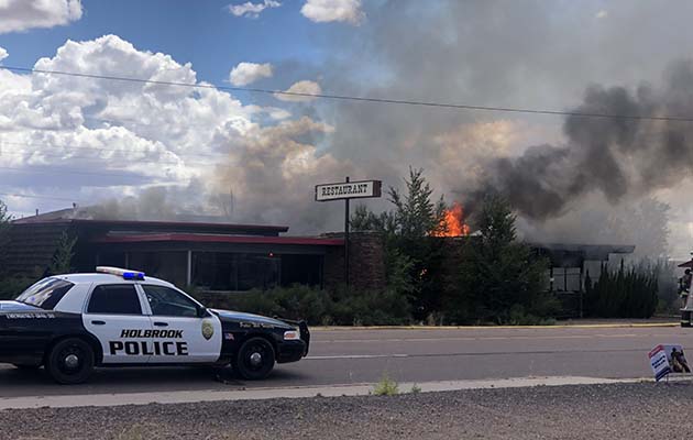 Photos by Linda KorA building at the abandoned Star Inn, located at 1009 W. Hopi Drive, was engulfed in flames on Thursday, July 28. Fire personnel from Holbrook, Joseph City and Winslow were on hand to battle the blaze, were able to contain the fire to the one building and kept it from spreading to the apartments behind the structure or the vacant building to the east. According to HVFD Chief Alex Baker, there was no definitive cause. “There was no electricity or gas service to the building, and it is suspected that someone started a fire and either didn’t put it out or left it burning.”
