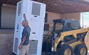 Photos by L. ParsonsPresident and Founder of Tsunami Products Kevin Conlin set up his atmospheric water generator at the Winslow Chamber of Commerce to demonstrate its effectiveness to meeting attendees last week. Winslow Mayor Roberta “Birdie” Cano sampled water produced by the generator and found it delicious.