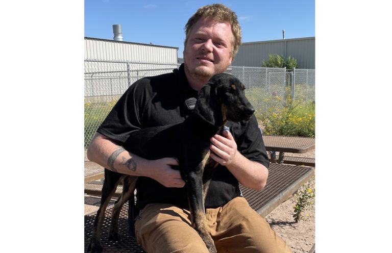 Animal Control Officer Brandon Smigiel visits with Grace, a 5-month-old hound mix that is now ready for adoption. Grace came to the shelter with health issues that have been addressed thanks to assistance from the Friends of Holbrook Animal Shelter.