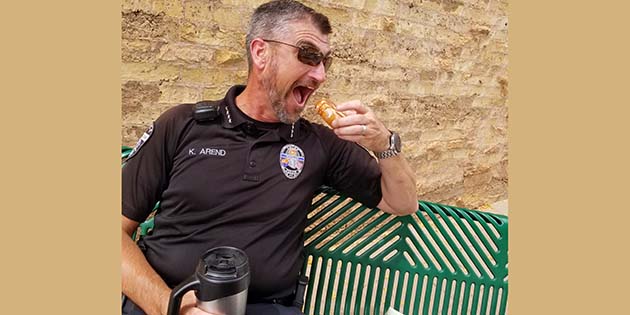 Photo by L. ParsonsWilling to take a ribbing for the stereotype Winslow Police Chief Ken Arend couldn’t resist partaking in the tasty donuts that were sold at the Standin’ on the Corner Park last week by a visiting out of town vendor.