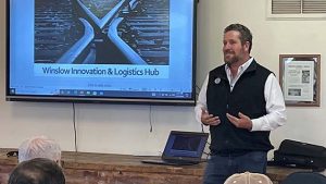 Daniel Lupien (pictured) one of the partners in Atlas Global Development Group explains to those at a public meeting the development he hopes to bring to Winslow that will provide industry and homes.