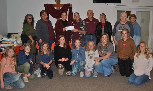 Photo courtesy of Holbrook Elks LodgeHolbrook Elks Lodge donated funds through a grant to support Oasis Youth Ministry. Pictured are (left to right) members Darlene Brinkerhoff, Yolanda Lincoln, Jennifer Ceccarelli, Phil Cobb, Jim Hall, Elvera Hall, Carrie Burgess, Shari Balda and a group of the young members in attendance.