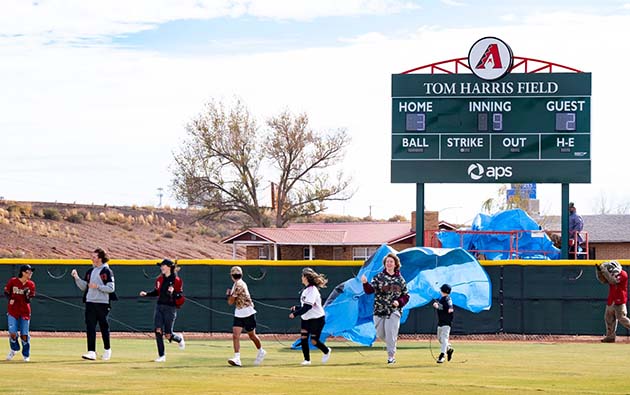 Photo by Jim BuckleyLocal youth unveil the scoreboard of the new Tom Harris Field dedicated in Winslow on Friday. The event brought a large turnout from the community and the surrounding area, as well as members of the Diamondback organization.