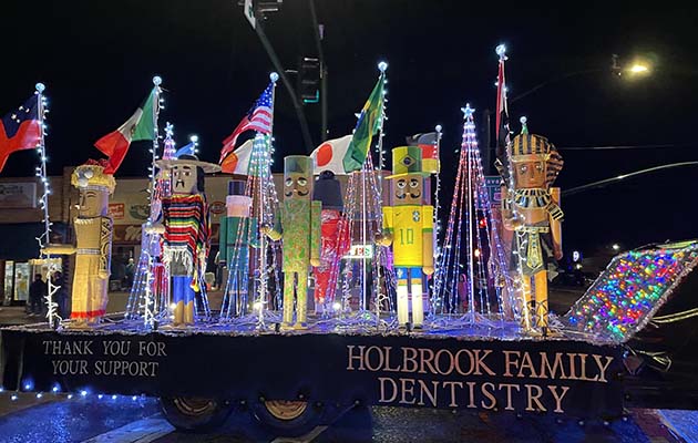 Holbrook Family Dental won Best Overall with its Nutcrackers Around the World float in last Saturday’s Parade of Lights. The holiday cheer could not be dampened even with the light rainfall as 27 entries made their way through the streets of downtown Holbrook.