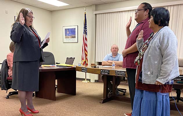 Photo by Shawn WhiteWilcox (center) and Dodie Montoya (right) take their oath of office after being elected and reelected to WUSD School Board. The oath was administered by Superintendent Connie Gover (left).