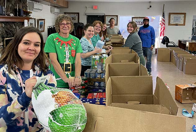 Photo by Mike NilssonVolunteers were on hand at the Holbrook Emergency Food Bank to serve others in the community on Dec. 17, filling a total of 110 boxes and bags with a turkey and other food to help those in need. Those who volunteered included Elzandro Benton, Katy Brown, Julie Smith, Amy Nilsson, Ashley Zehrung, Linda Stoffer, Kathy Wauneka, Pete Roach, Kerry Ozment, Christine Nilsson and Mike Nilsson. The food was distributed earlier this week to Holbrook residents.