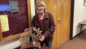 Photo by Shawn WhiteMarilee Ervien was presented with a Bulldog for her service to WUSD.