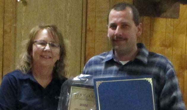 Photos courtesy of the Holbrook Chamber of CommerceChamber President Janet Dean (left) presents the award to Holbrook’s Man of the Year Brian Reid (right).