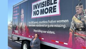 Photo by Shawn WhiteElizabeth Johnson standing with the trailer she has been driving around the country for two years spreading awareness of missing and murdered indigenous women.