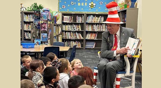 Photo courtesy of the Navajo County Attorney’s OfficeMarch 2 was National Read Across America Day and Dr. Seuss' birthday, so Navajo County Attorney Brad Carylon donned his Cat in the Hat hat and socks and had a great morning sharing Dr. Seuss with kindergarteners and first graders at Park Elementary School in Holbrook. “My parents were readers, they helped me become a lifelong reader, and I had the joy of encouraging my kids to become readers from a very young age. Read to a child when you get the chance -- the delight in their eyes will take you back to your own childhood flights of fancy, and who doesn't want to experience that from time to time?” stated Carlyon.