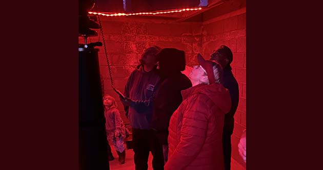 Photo by Shawn WhiteLocals and tourists alike line up to see the constellations as they learn from Dr. Danielle Adams.