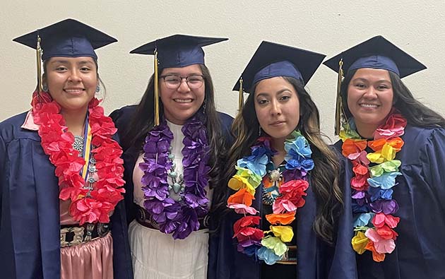 Photos by Linda KorJCHS seniors (left to right) Cyerra Yazzie, Adilene Claw, Madison John and Alana Horn spend their last moments together as high school seniors before talking the stage to graduate.