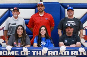 Photo by Kellie Spangler/SpanglerpicsMacy Moore (front row, center) signed her letter of intent to play volleyball and softball at Dakota Wesleyan University in Mitchell, S.D. She will be studying nursing at DWU and has received academic, volleyball and softball scholarships from DWU. She has also received an Elks Scholarship. She was named to the second team all-region for volleyball and region player of the year and first team all-conference for softball. Also pictured is her travel ball coach John Fockler, High school volleyball coach AB Larose (front row, left), high school softball coach Scott Baker (back row, center) and DWU softball coach Tommy Downs.