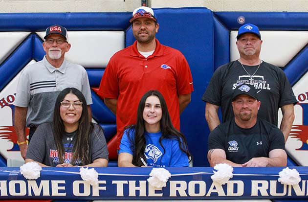 Photo by Kellie Spangler/SpanglerpicsMacy Moore (front row, center) signed her letter of intent to play volleyball and softball at Dakota Wesleyan University in Mitchell, S.D. She will be studying nursing at DWU and has received academic, volleyball and softball scholarships from DWU. She has also received an Elks Scholarship. She was named to the second team all-region for volleyball and region player of the year and first team all-conference for softball. Also pictured is her travel ball coach John Fockler, High school volleyball coach AB Larose (front row, left), high school softball coach Scott Baker (back row, center) and DWU softball coach Tommy Downs.