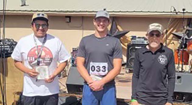Photo by Yvonne LarsonFirst place winners of the Bucket of Blood races include (left to right) Corey Keyonnie in the 10K, Tate Skousen in the half marathon and Bad Mugg in the 5K.