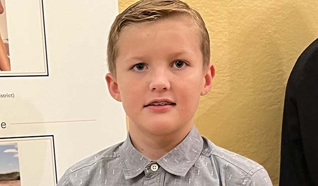 Photo courtesy of The Ferraro GroupCallum Richards of Winslow is shown here with his photo as displayed at the Arizona Capitol Museum.