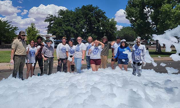 Photo courtesy of the Petrified Forest National ParkMembers of the Petrified Forest National Park Youth Conservation Corps took a break from their labors to enjoy some bubbles at the Holbrook Public Library. Pictured are (left to right) Luke Heberer, Elena Philpott, Tayshaun Brown, Desiree Dyer, Skyler Joe, Arial DoBell, Tamaryn Baldonado, Sara Speers, Samuel Paschal, Denessa Begay, Sage Peterson, Keagan Joe, Calie Etsitty, and Ephriam Benally.