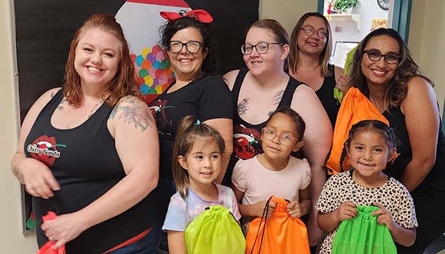 Photo courtesy of the Cherry BombsKids throughout local communities received school supplies courtesy of the Cherry Bombs and local businesses. Pictured are (front row, left to right) first graders Josslyn Gillespie, Courtanna Gurule, Zuri Kee, and (back row) Cherry Bombs Miss Ruby Wild, Jillian Angel, Khloe Rosè, Ivey Rose and Sapphire Rose.