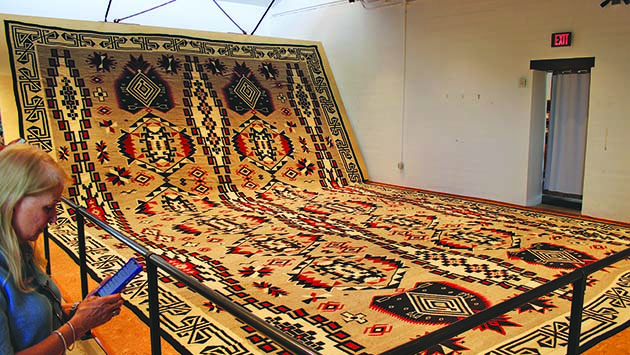 Photo by Shawn WhiteThe Hubbell-Joe Rug, a remarkable collaboration between Lorenzo Hubbell Jr. and master weaver Julia Joe, takes center stage at the Affeldt Mion Museum. This immense Navajo weaving, unveiled last Saturday, embodies intricate artistry and cultural heritage.