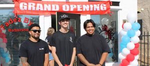 Photo by Shawn WhiteJalen Hayes (left), Joseph Romero (middle) and Steven Serious (right) stand in front of their new businesses in Winslow during their grand opening.