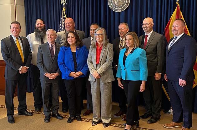 Community college leaders recently met with Governor Katie Hobbs. Pictured are (front row, left to right) Todd Haynie, Eastern Arizona College; Dolores Duran-Cerda, Pima Community College; Katie Hobbs, Governor; Lisa Rhine, Yavapai College, (back row) Daniel Corr, Arizona Western College; Andrew Clegg, Central Arizona College; JD Rottweiler, Cochise College; Steven Gonzales, Maricopa Community Colleges; Stacy Klippenstein, Mohave Community College; Chato Hazelbaker, Northland Pioneer College; and Eric Heiser, Coconino Community College.
