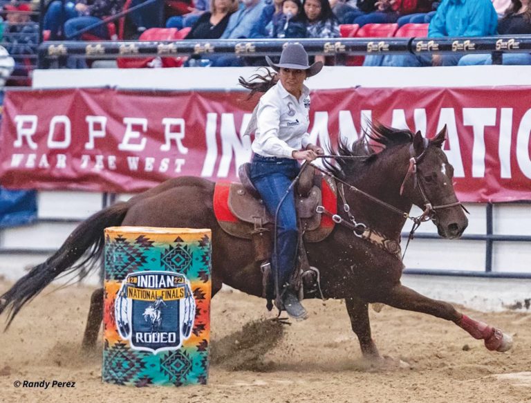 Tara Seaton of Dilkon and her horse Wag Rez Rocket earn top slot competing in the Indian National Finals Rodeo in Las Vegas. Photo by Randy Perez