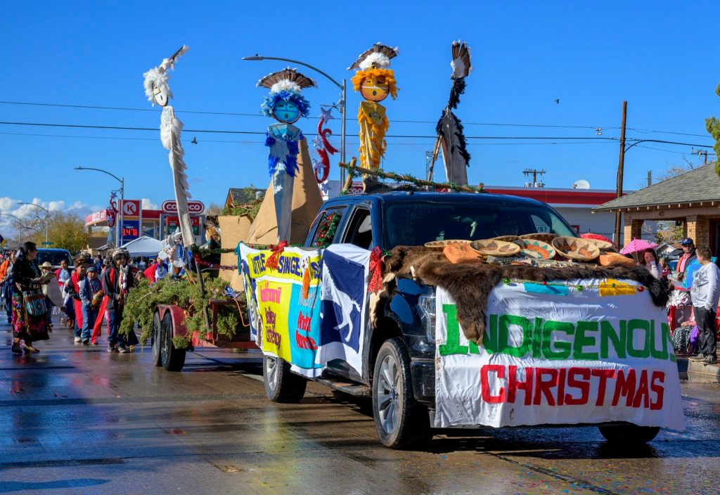 Photos by Jim BuckleyLittle Singer Community School presents a striking parade float featuring life-sized kachina dolls as part of the Winslow Christmas Parade held on Saturday.