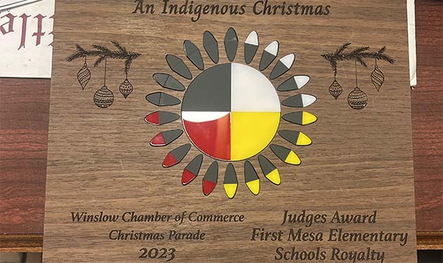 Photo by Shawn WhiteThis photo shows one of the awards handed out to the winners of Winslow’s Christmas Parade. The awards were made by Tommy Butler and feature the winner’s names and 22 feather design representing Arizona’s 22 tribes.