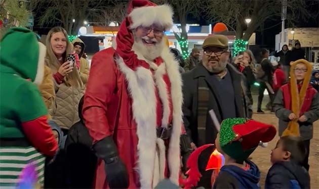 Photos by Kathleen SmithSanta showed up at Holbrook’s Tree Lighting last Thursday in style, foregoing his sleigh for a Harley Davidson motorcycle. After arriving he visited with many children eager to share their Christmas wish list with him.