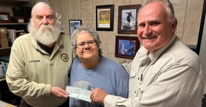 Photo courtesy of Lisa SalazarJohn Schneider (left), representing the Navajo County Sheriffs Auxiliary, presented this check for $3,750 to the Holbrook Senior Center for the Meals on Wheels program/food service programs. Accepting the check on behalf of the center were Director Lisa Salazar (center) and Board President Mike Nilsson (right).